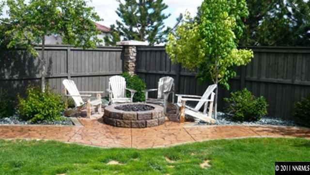 615 Royal Windsor Court Reno, NV 89521 - Photo 13 of 13 a view of a chair and fire pit in backyard of the house