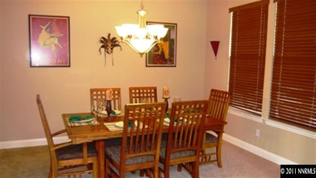 615 Royal Windsor Court Reno, NV 89521 - Photo 4 of 13 a view of a dining room with furniture and wooden floor
