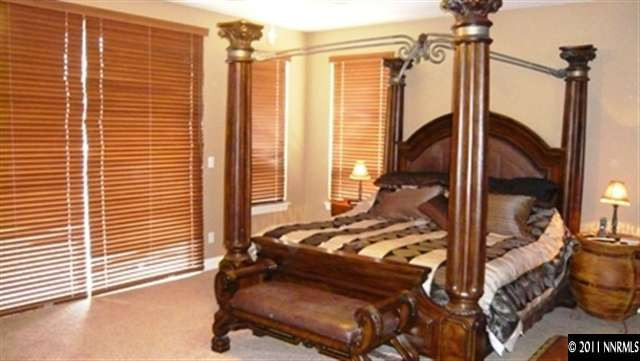 615 Royal Windsor Court Reno, NV 89521 - Photo 7 of 13 a bed sitting in a room next to a window