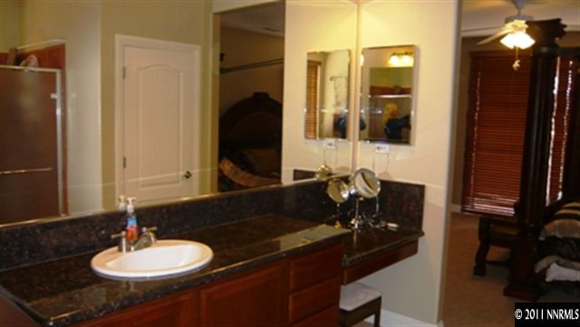 615 Royal Windsor Court Reno, NV 89521 - Photo 8 of 13 a bathroom with a sink and a mirror