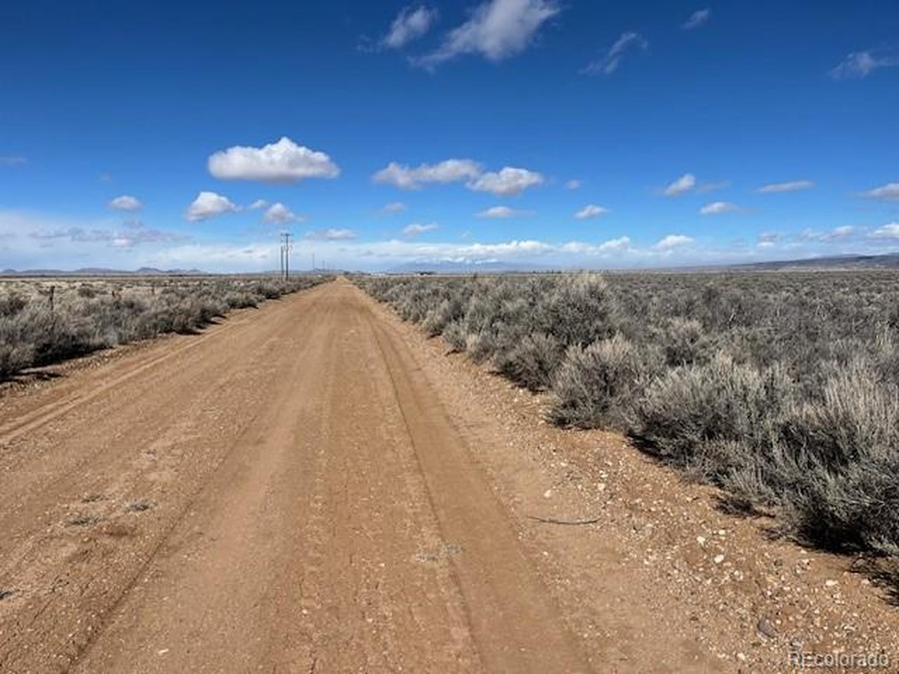 12 County Road East San Luis, CO 81152 - Photo 6 of 12 a view of a pathway with a yard