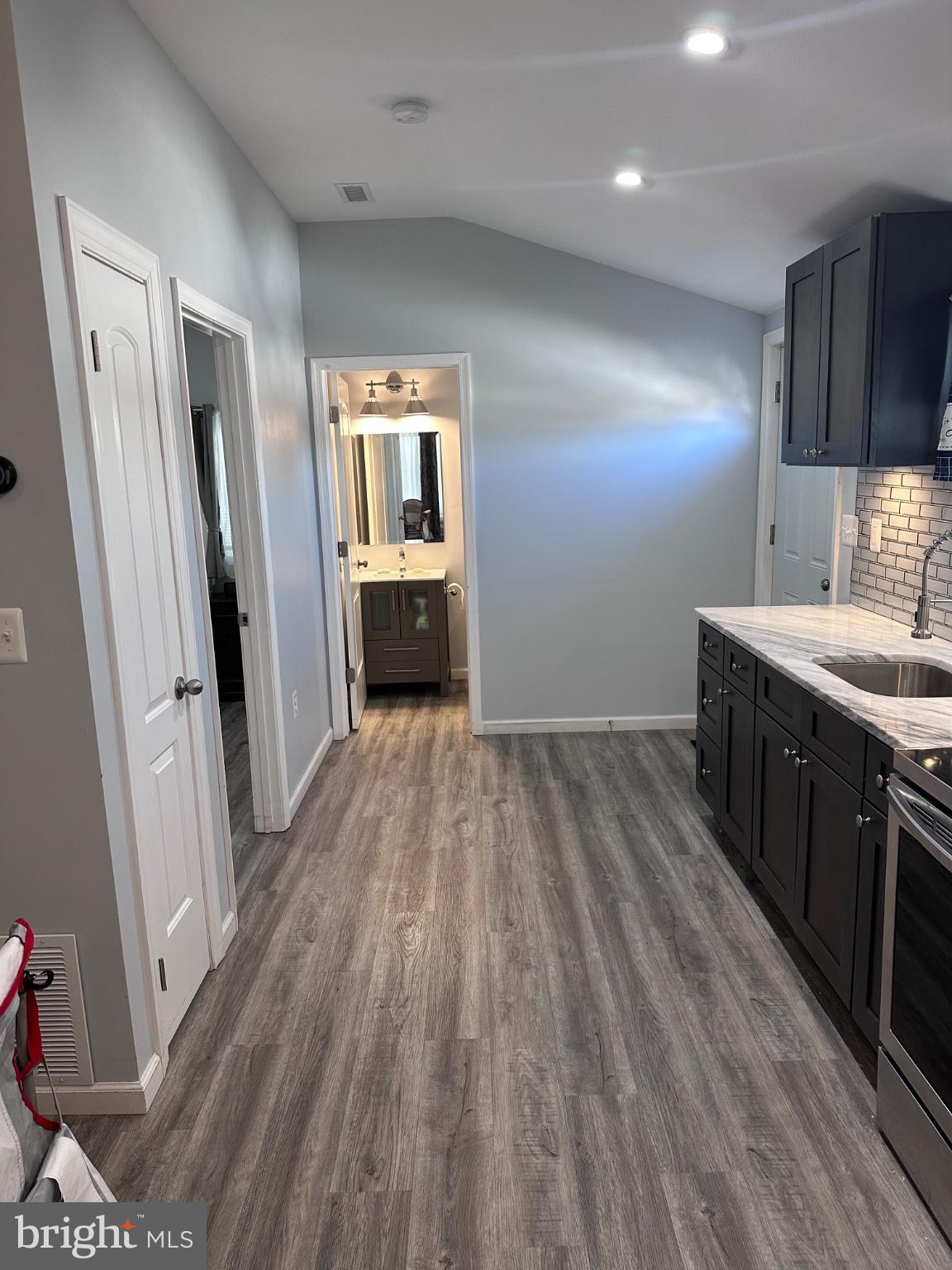 902 B Edgerly Road Glen Burnie, MD 21060 - Photo 11 of 12 Modern kitchen with sleek finishes.