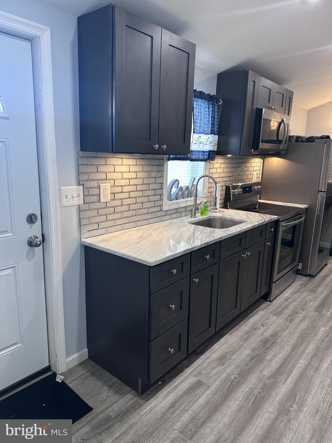 902 B Edgerly Road Glen Burnie, MD 21060 - Photo 3 of 12 Modern kitchen with sleek cabinetry.