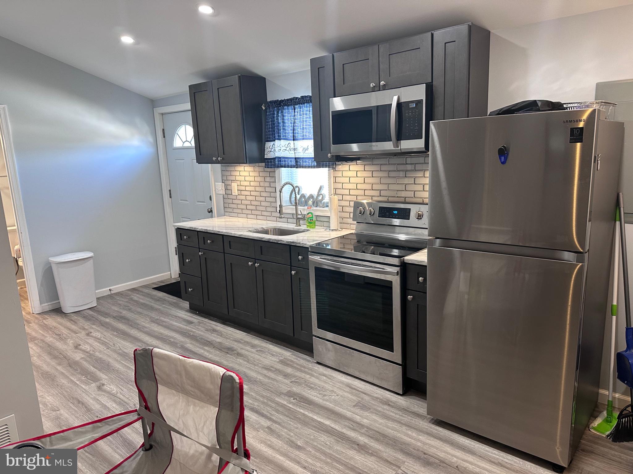 902 B Edgerly Road Glen Burnie, MD 21060 - Photo 7 of 12 Modern kitchen with sleek finishes.