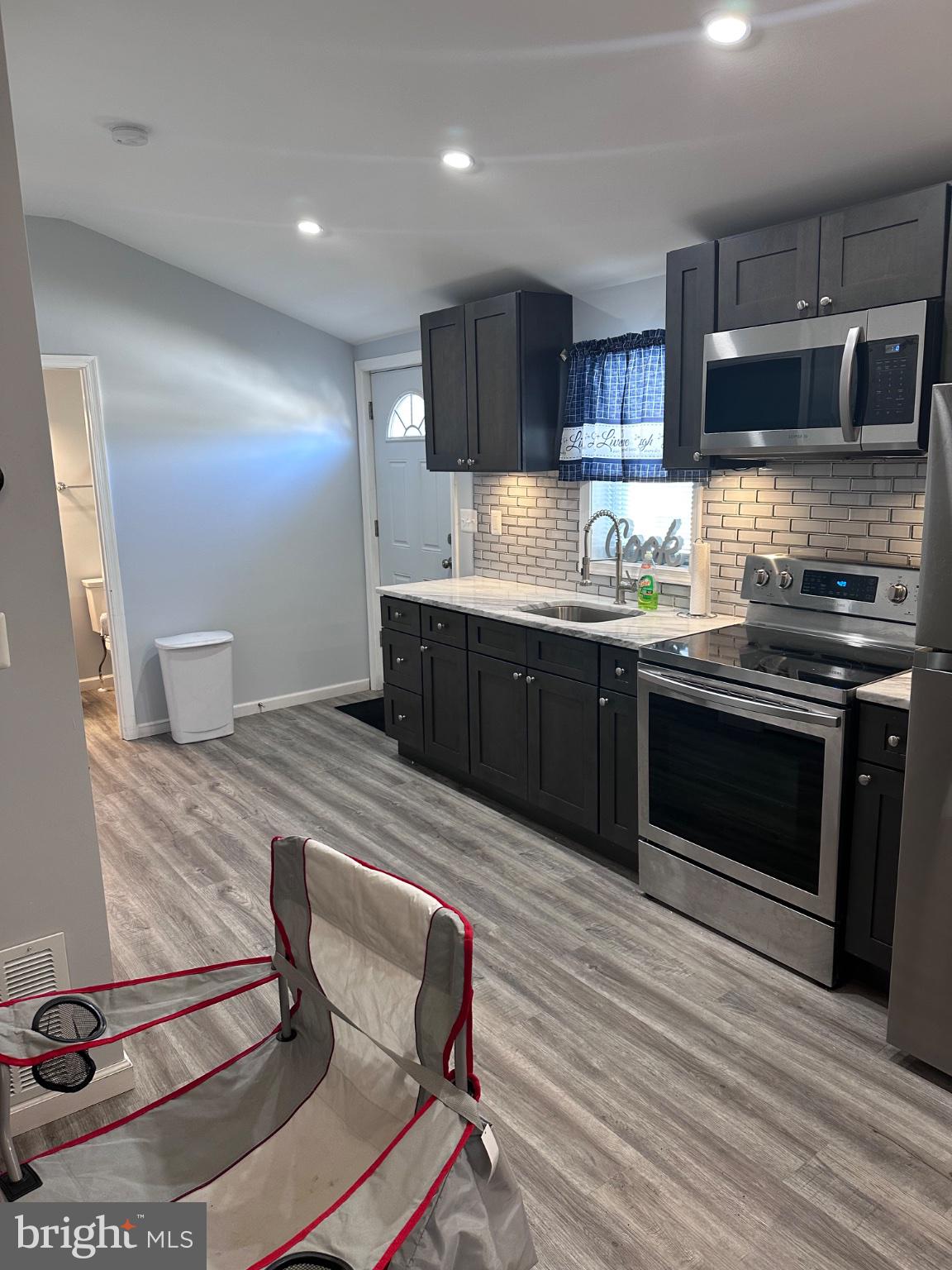902 B Edgerly Road Glen Burnie, MD 21060 - Photo 8 of 12 Modern kitchen with sleek finishes.