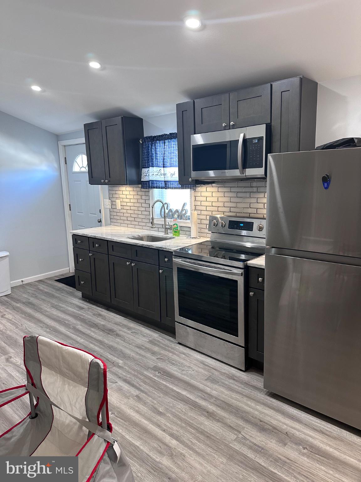902 B Edgerly Road Glen Burnie, MD 21060 - Photo 9 of 12 Modern kitchen with sleek finishes.