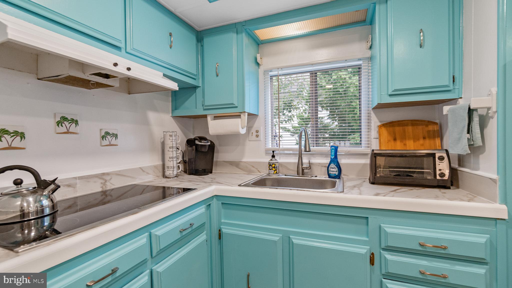 13324 Nantucket Road Ocean City, MD 21842 - Photo 12 of 45 a kitchen with sink a window and appliances