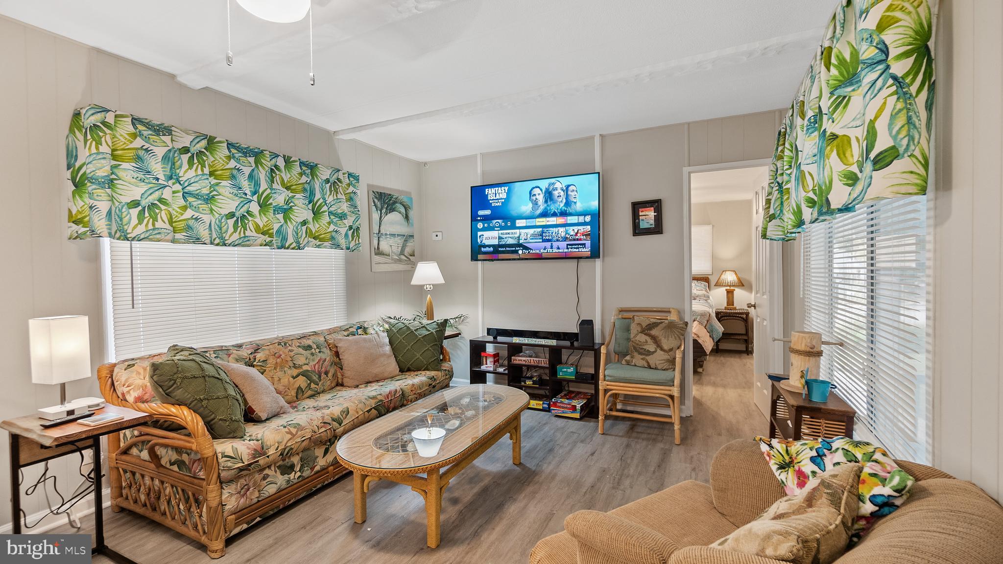 13324 Nantucket Road Ocean City, MD 21842 - Photo 18 of 45 a living room with furniture and a flat screen tv