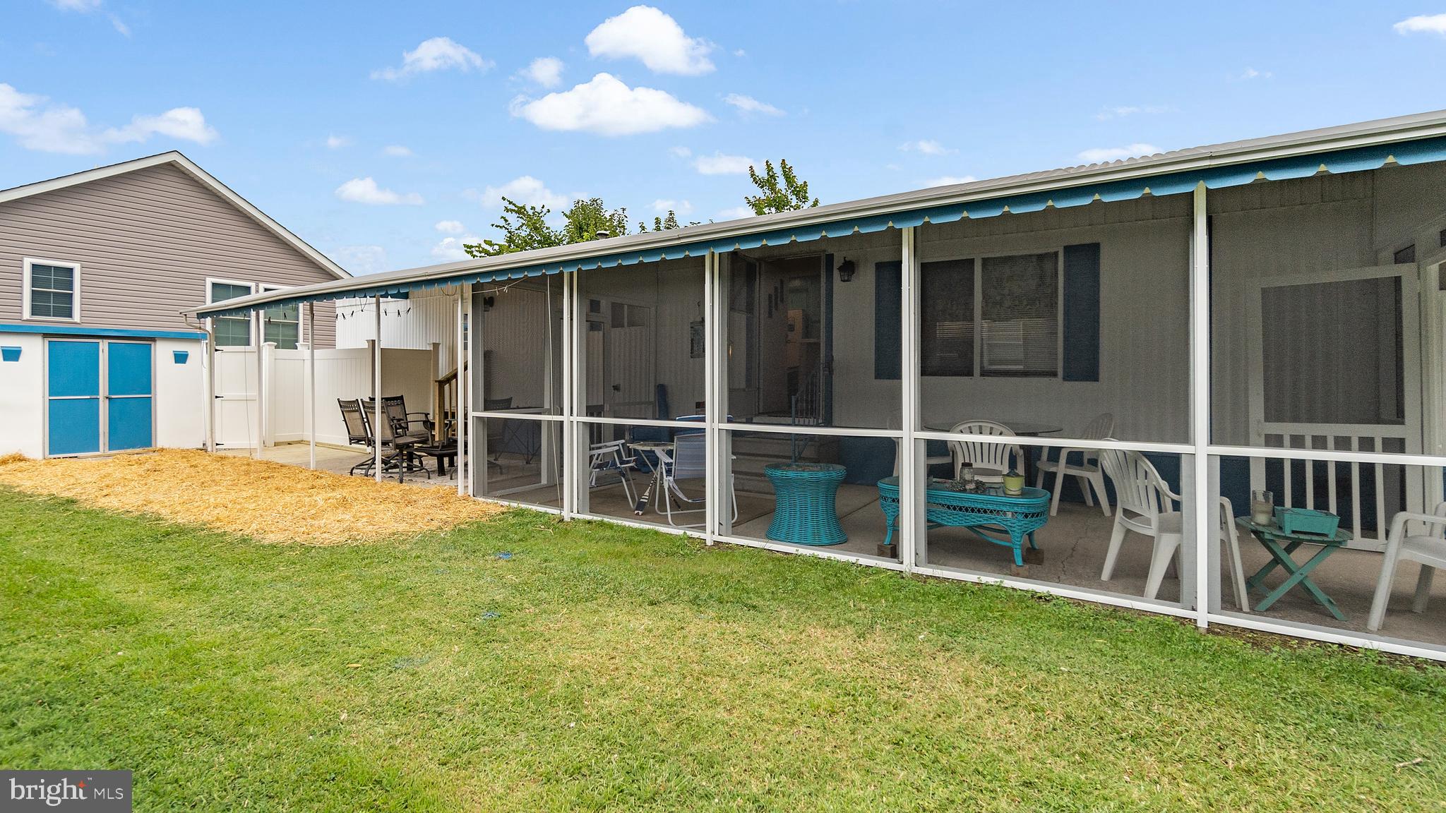 13324 Nantucket Road Ocean City, MD 21842 - Photo 2 of 45 a view of a backyard with floor to ceiling window and wooden fence