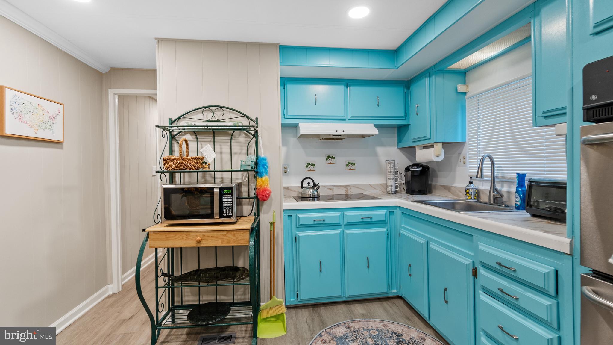 13324 Nantucket Road Ocean City, MD 21842 - Photo 23 of 45 a kitchen with a cabinets and appliances