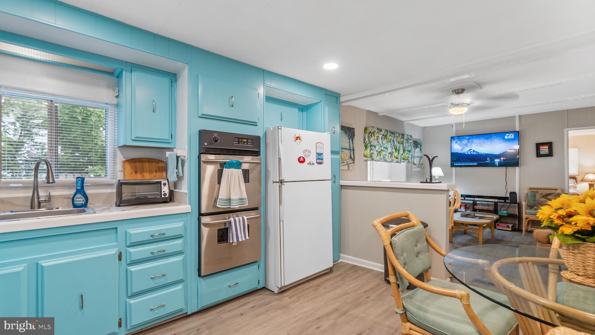 13324 Nantucket Road Ocean City, MD 21842 - Photo 26 of 45 a kitchen with refrigerator cabinets furniture and a window