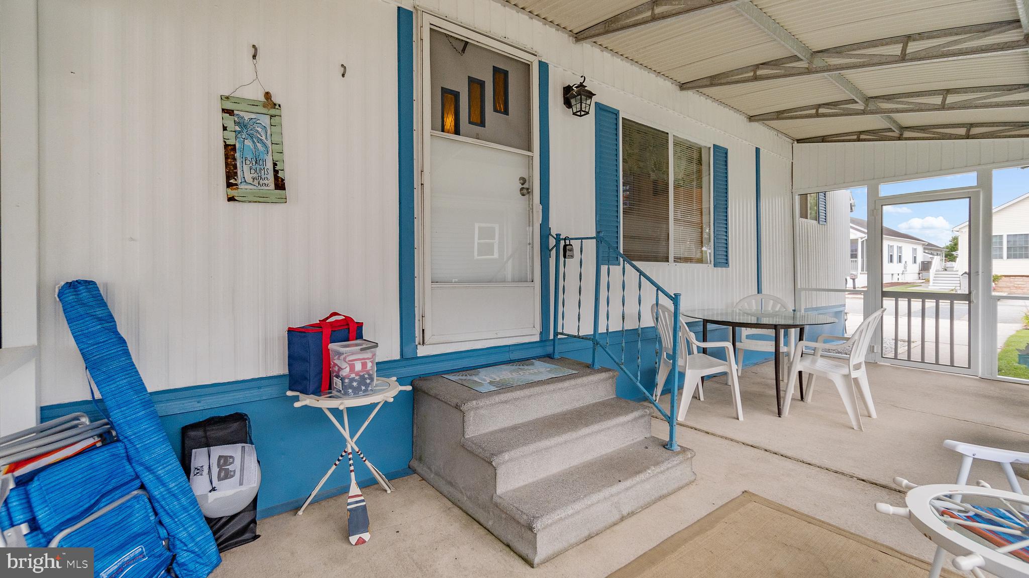 13324 Nantucket Road Ocean City, MD 21842 - Photo 8 of 45 a living room with furniture a dining table and wooden floor