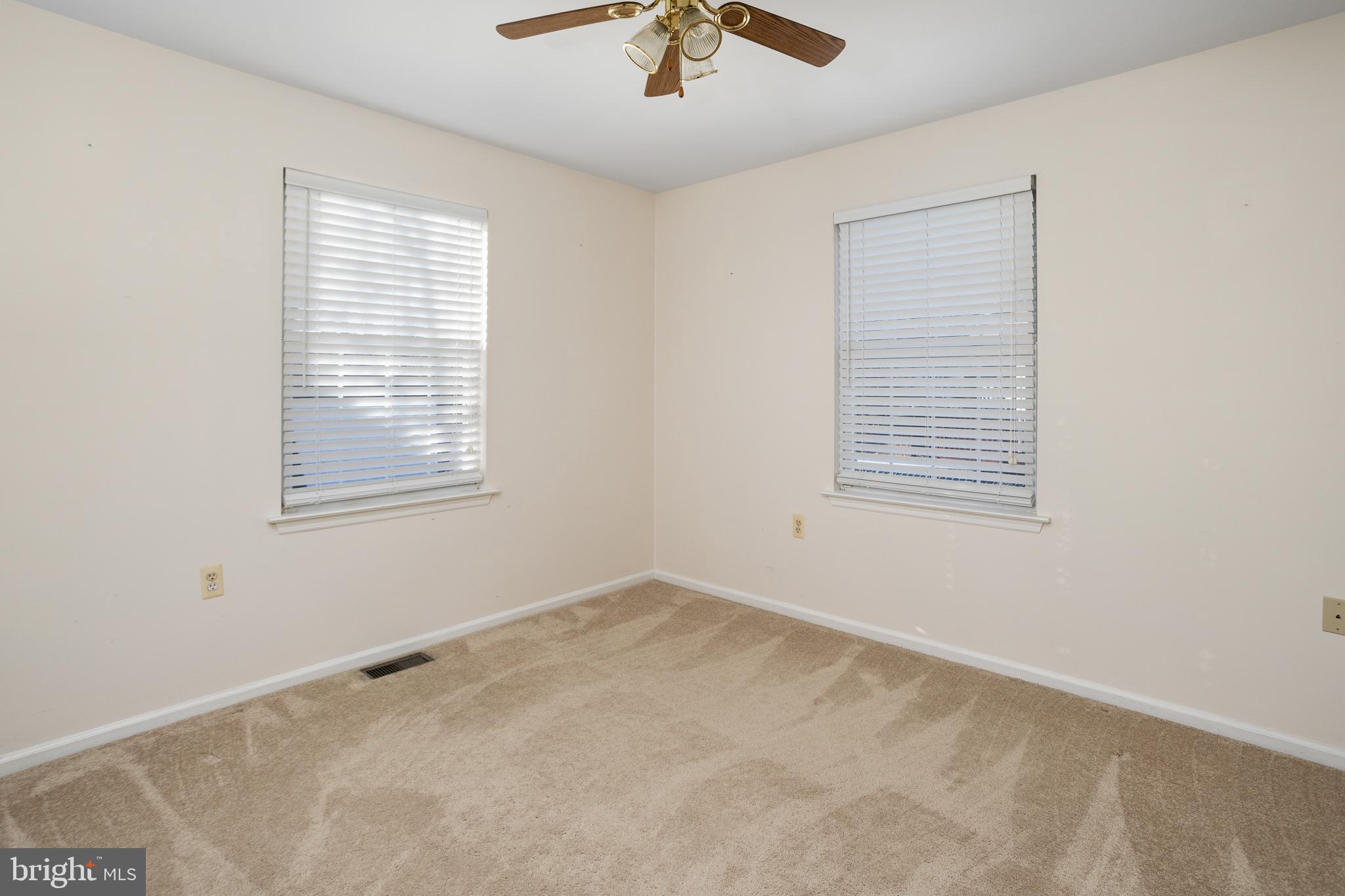 3 Escambia Trail Browns Mills, NJ 08015 - Photo 23 of 30 an empty room with a window and a fan