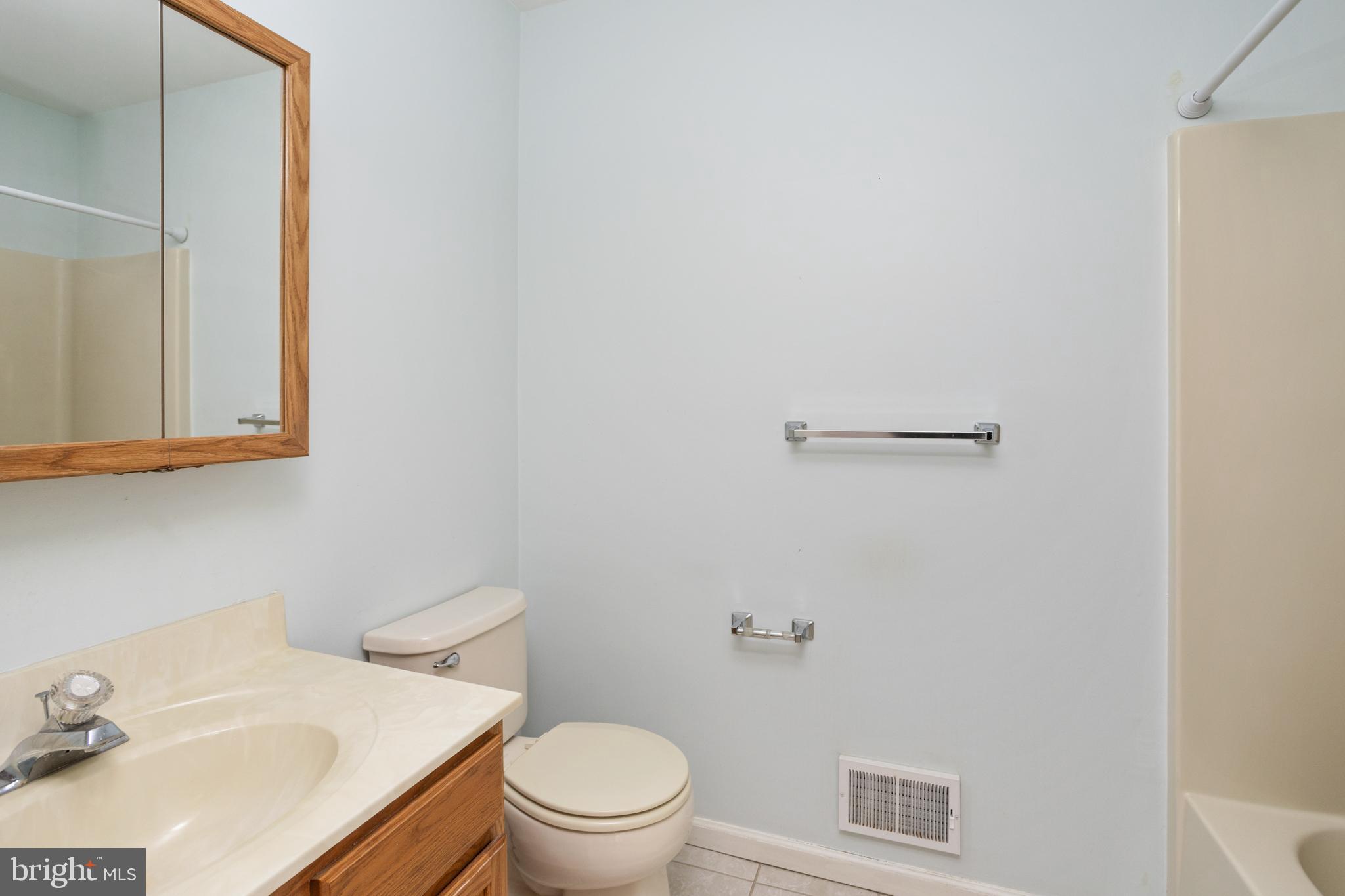 3 Escambia Trail Browns Mills, NJ 08015 - Photo 24 of 30 a white toilet sitting next to a bathroom sink
