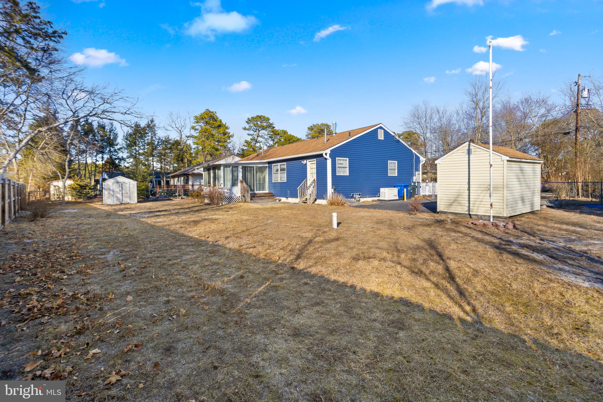 3 Escambia Trail Browns Mills, NJ 08015 - Photo 26 of 30 a front view of a house with a yard and mountain view