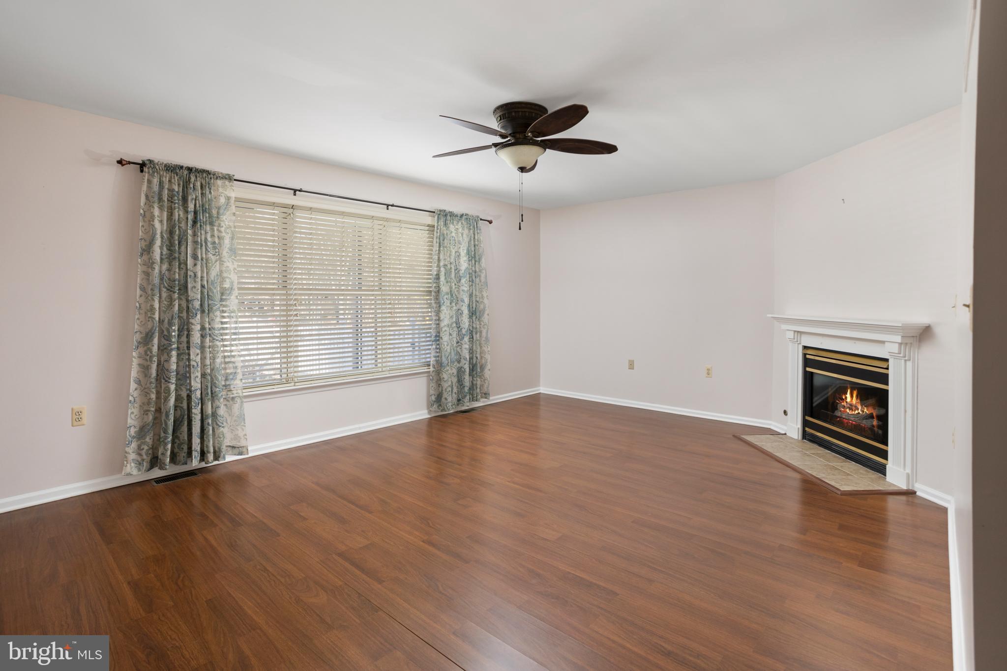 3 Escambia Trail Browns Mills, NJ 08015 - Photo 5 of 30 a view of an empty room with a window and wooden floor