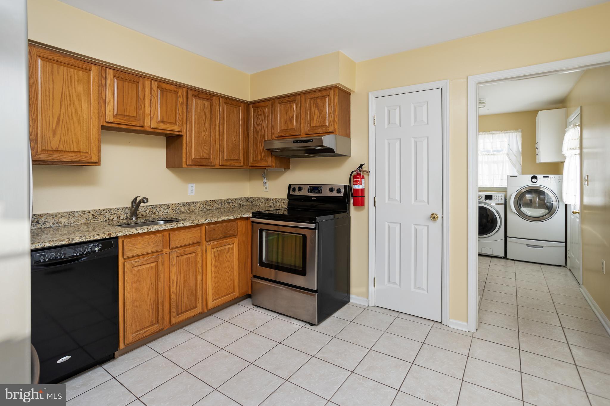 3 Escambia Trail Browns Mills, NJ 08015 - Photo 9 of 30 a kitchen with granite countertop a stove a sink and a refrigerator