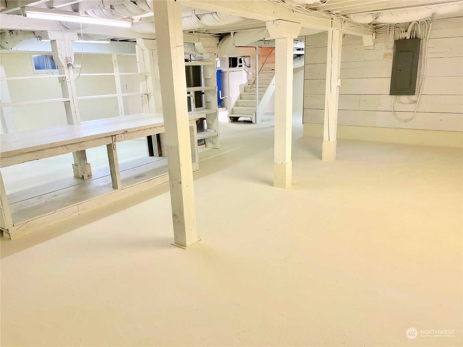 19589 Kelleher Road Burlington, WA 98233 - Photo 26 of 39 a view of a hallway with wooden floor and a living room