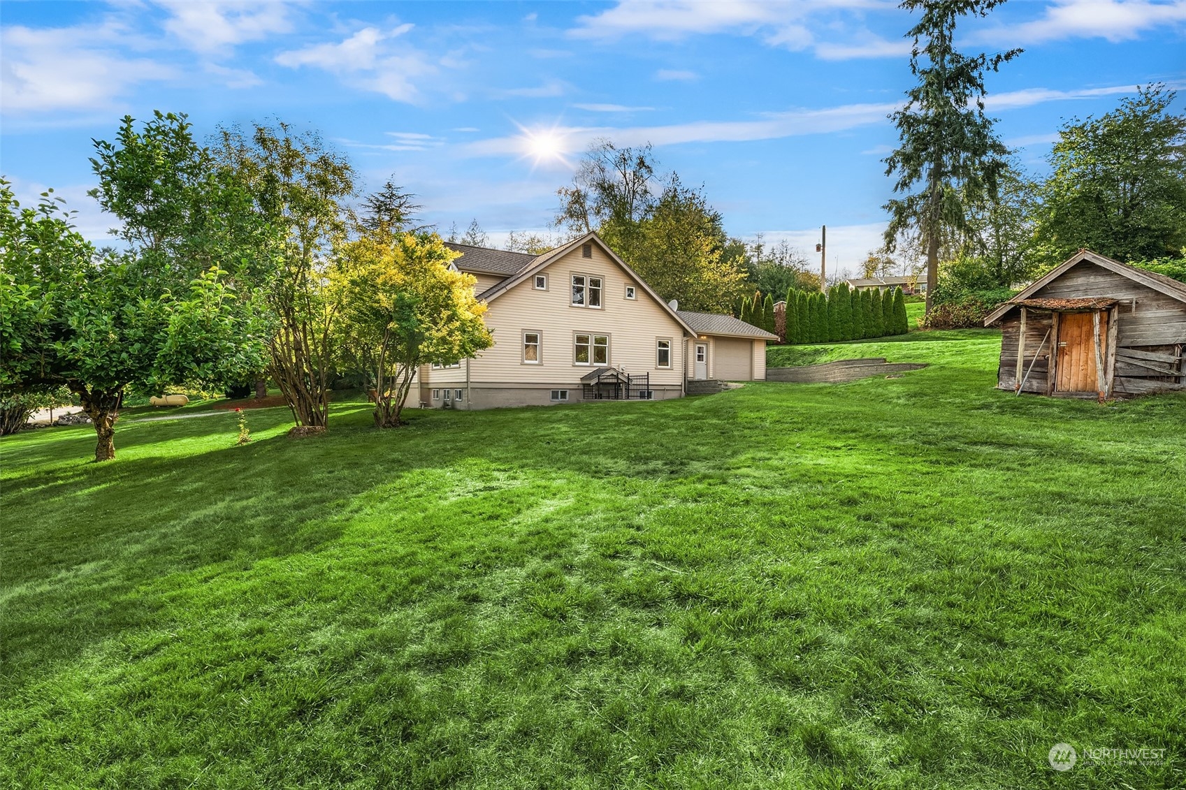 19589 Kelleher Road Burlington, WA 98233 - Photo 31 of 39 a view of a house with a big yard and large trees