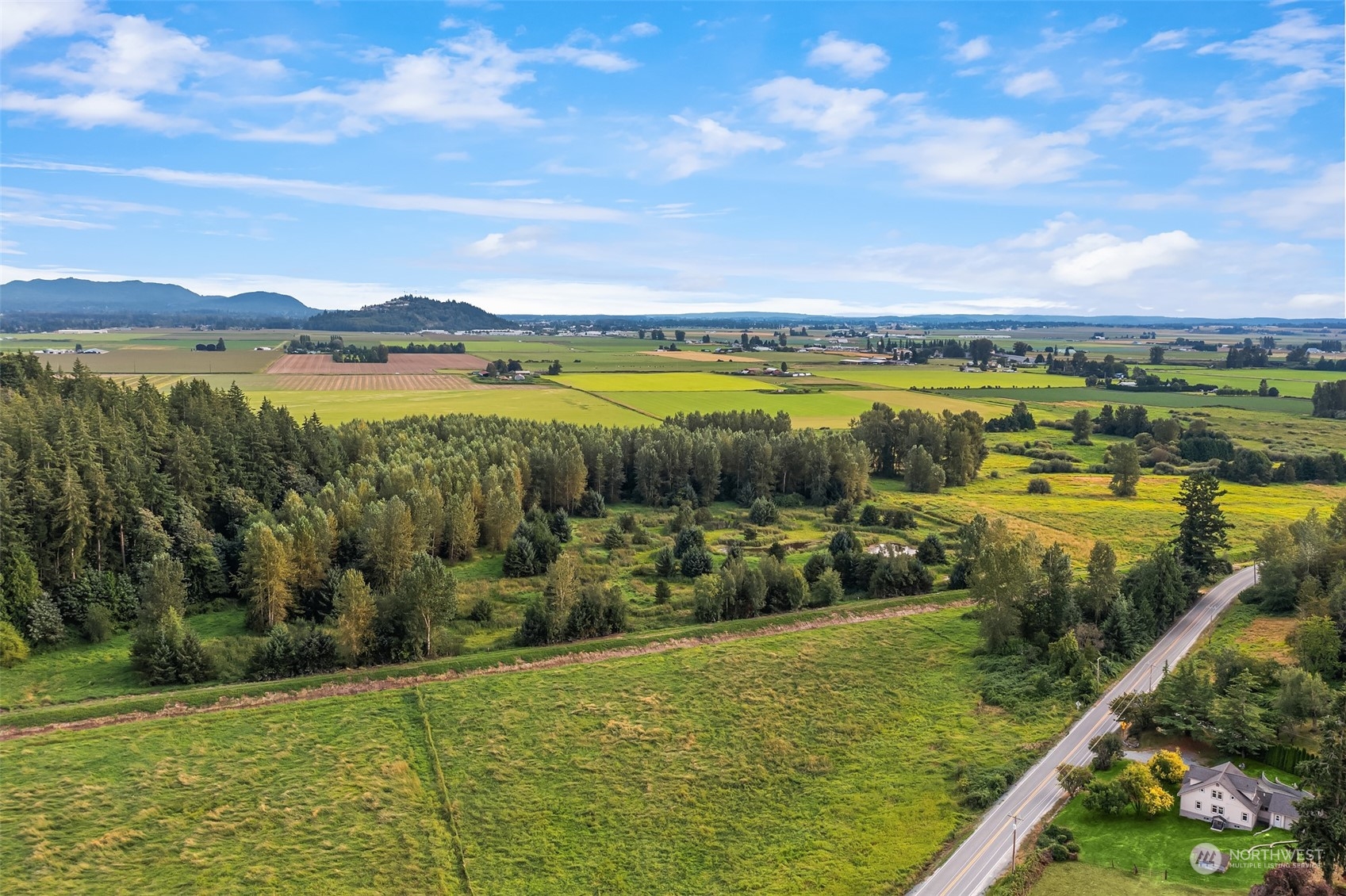 19589 Kelleher Road Burlington, WA 98233 - Photo 38 of 39 a view of a lake with houses in the back