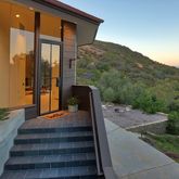 a view of a patio with a table and chairs