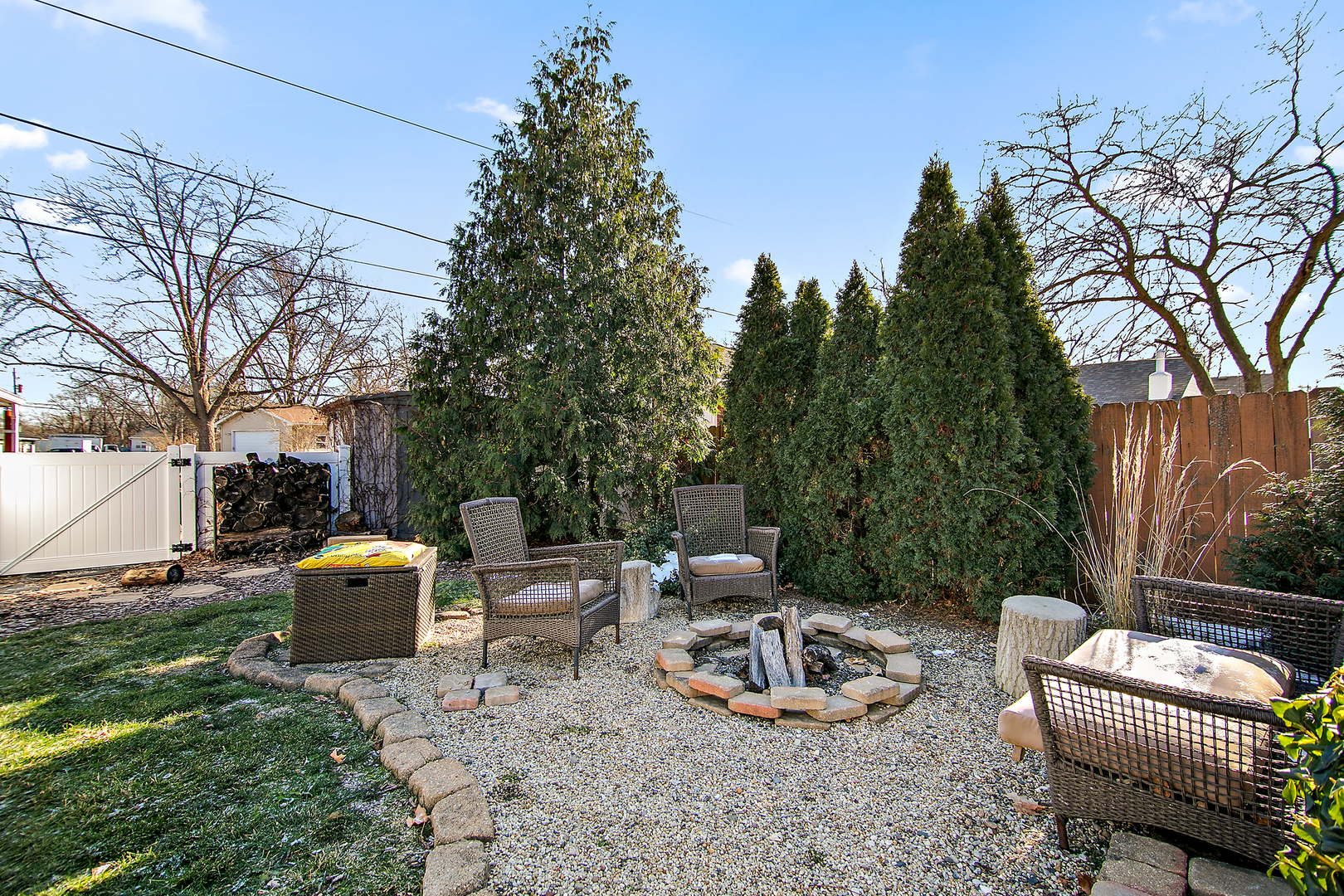 460 South Winfield Avenue Kankakee, IL 60901 - Photo 5 of 28 a backyard of a house with fire pit and outdoor seating