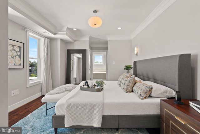 a view of a pathway with a wrought fence