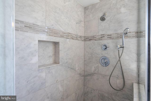 a city street lined with buildings and cars