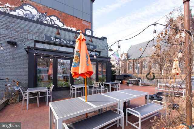 a view of a terrace with sitting area