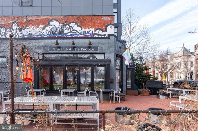a view of a balcony with wooden floor and fence