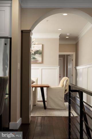 a balcony with table and chairs