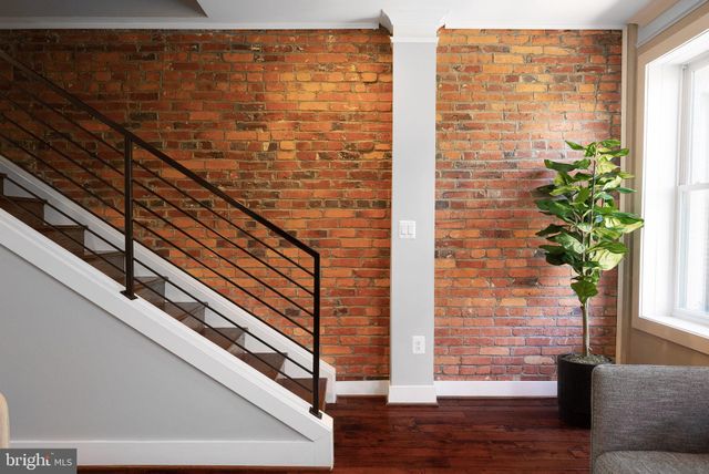 a view of entryway with wooden floor