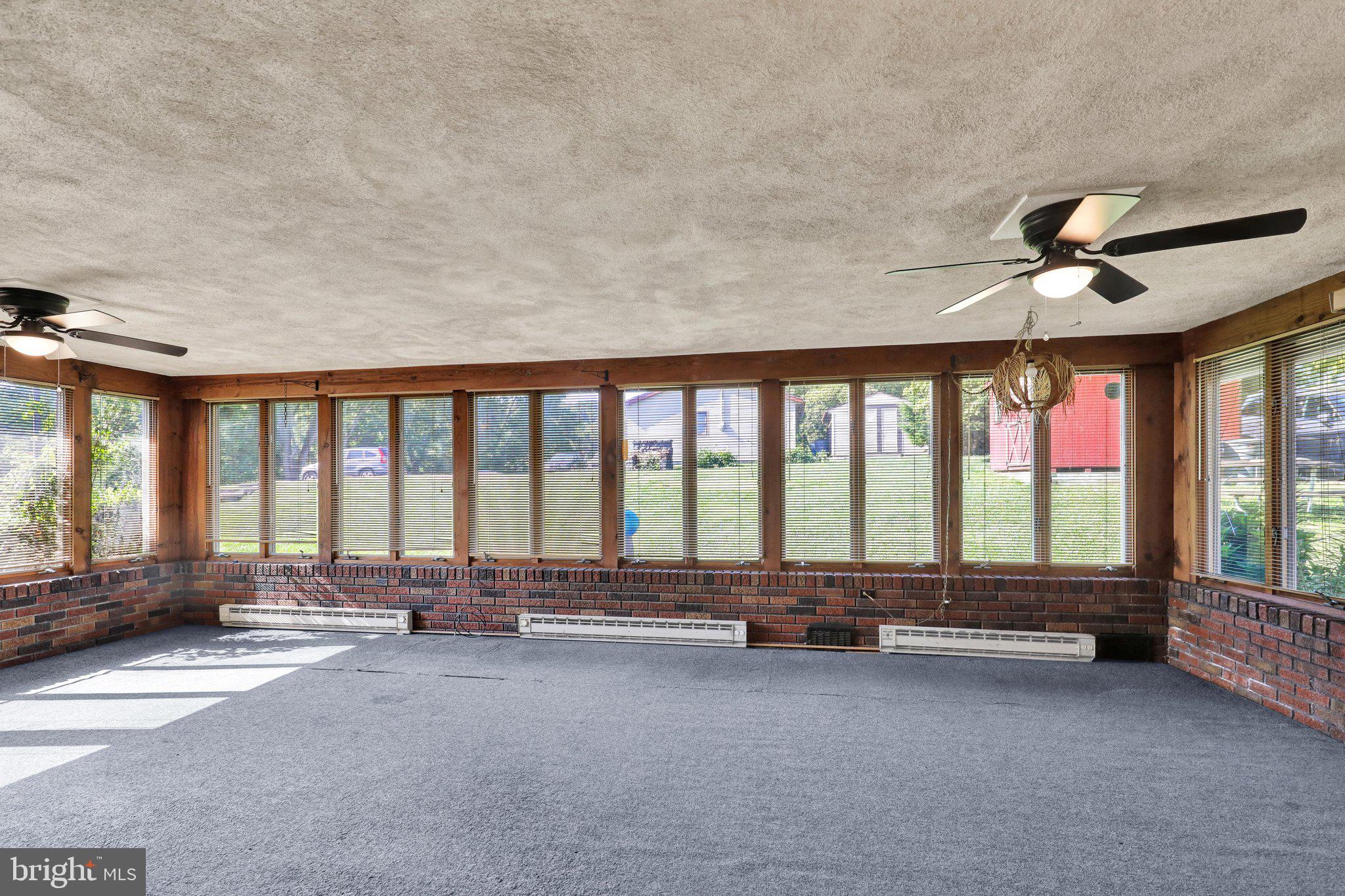 24 Ardmore Avenue Reading, PA 19607 - Photo 11 of 40 a swimming pool with outdoor seating and large windows