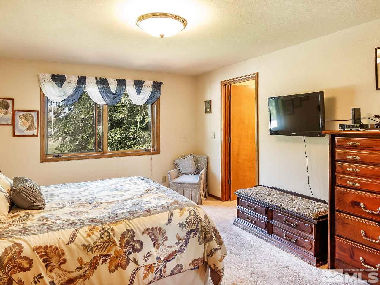 3258 Bottom Road Fallon, NV 89406 - Photo 15 of 25 a bedroom with a bed and furniture