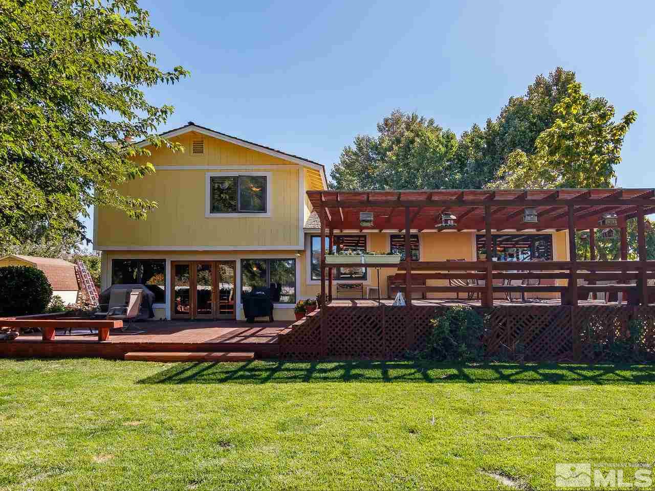 3258 Bottom Road Fallon, NV 89406 - Photo 22 of 25 a view of a house with a swimming pool
