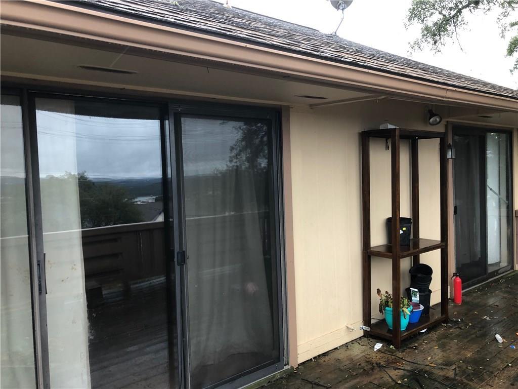 1 Oaks Place Lago Vista, TX 78645 - Photo 10 of 13 Entrance to property with a shingled roof