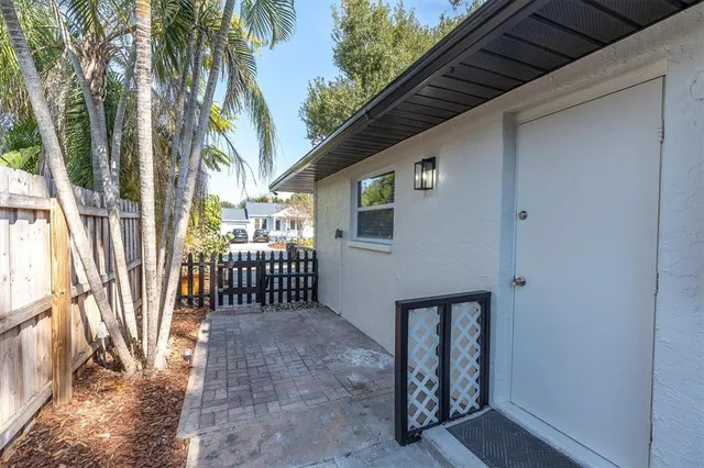 a patio with table and chairs