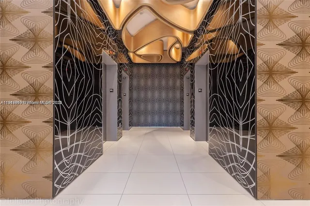 a large white sitting area with large window