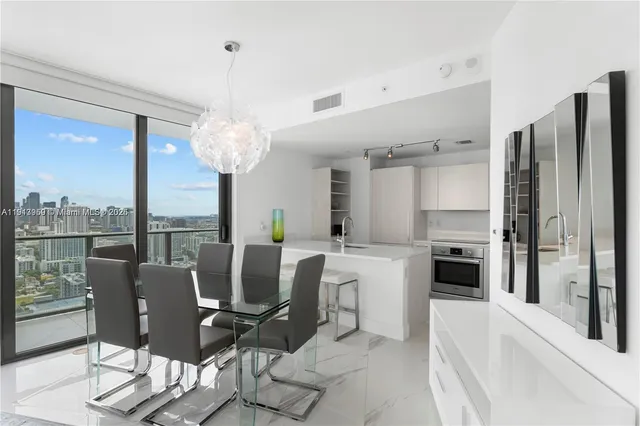 a view of a dining room with furniture window and outside view