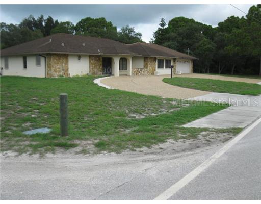 707 Shore Road Nokomis, FL 34275 - Photo 1 of 1 Exterior Front - Circular drive and extra pad afford ample parking. Corner lot less than one mile to Nokomis Beach!
