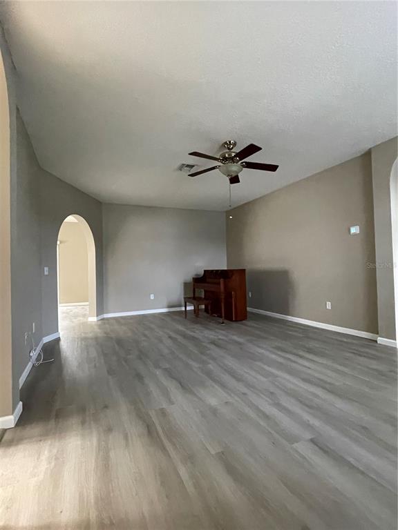 4939 Woodmere Road Land O Lakes, FL 34639 - Photo 26 of 43 a view of empty room with wooden floor