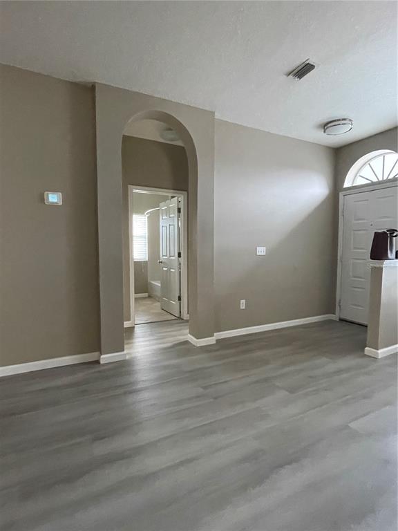 4939 Woodmere Road Land O Lakes, FL 34639 - Photo 28 of 43 a view of a room with wooden floor and a window