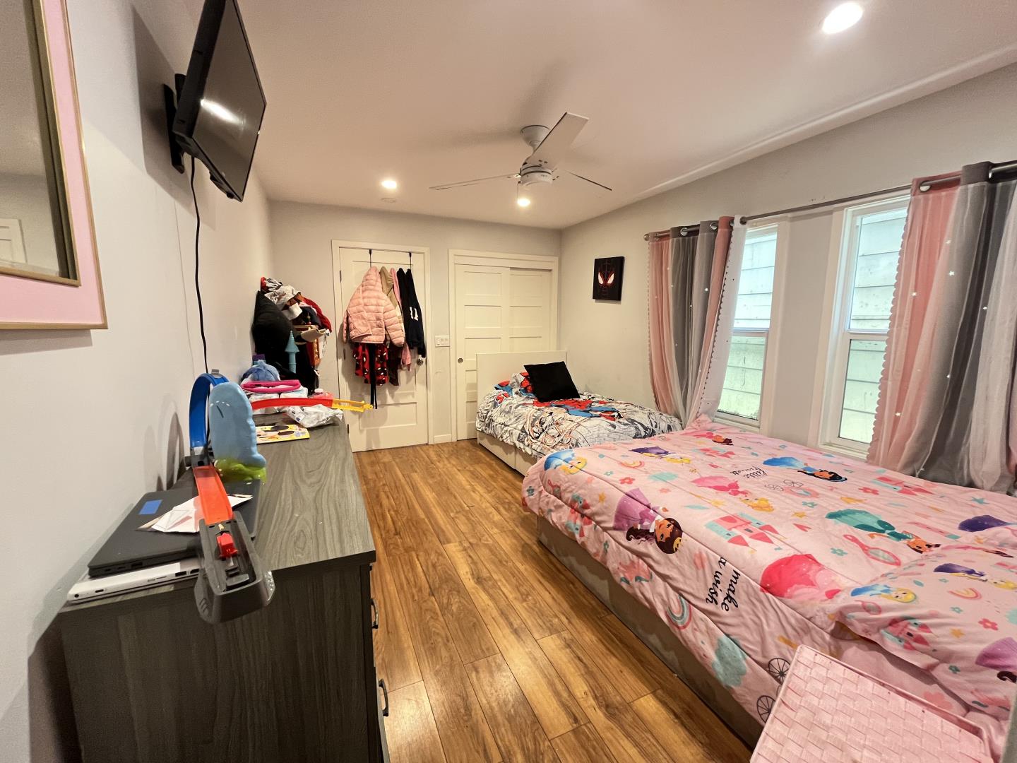 1439 38th Avenue Oakland, CA 94601 - Photo 11 of 15 a bed room with a bed tv and a window