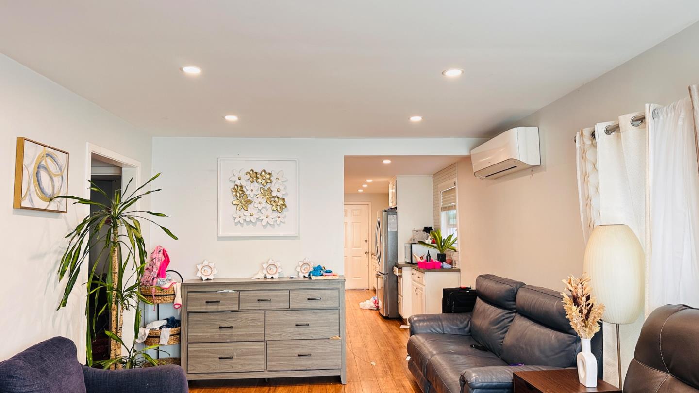 1439 38th Avenue Oakland, CA 94601 - Photo 7 of 15 a living room with furniture and a flat screen tv
