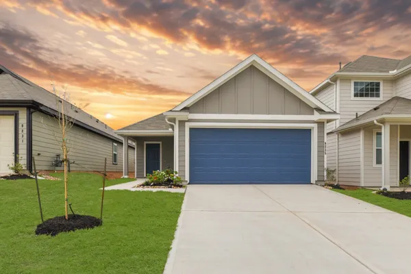 a view of a yard in front view of a house