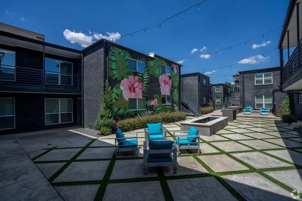 a outdoor space with lots of tables and chairs