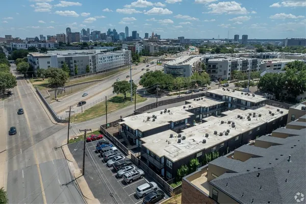 a view of a terrace with furniture and city view
