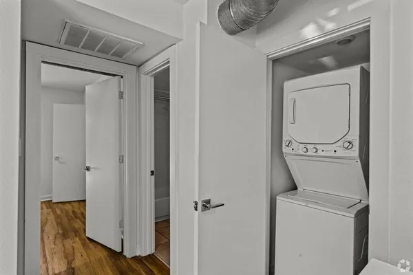 a bathroom with a toilet and a mirror