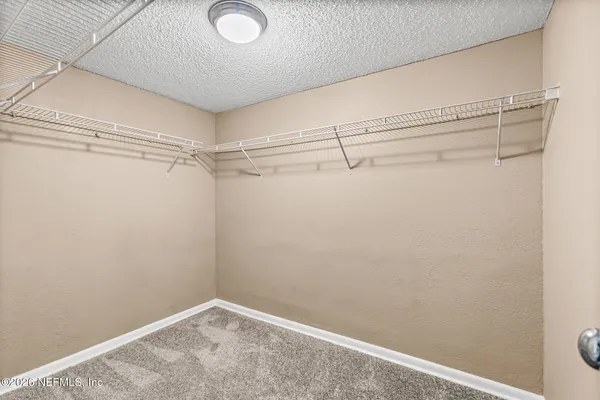 a view of a room with racks on the wall