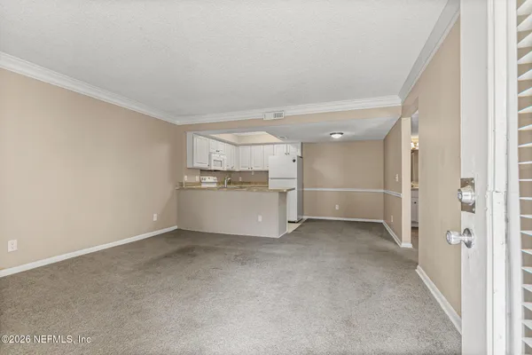 a view of a kitchen with a sink